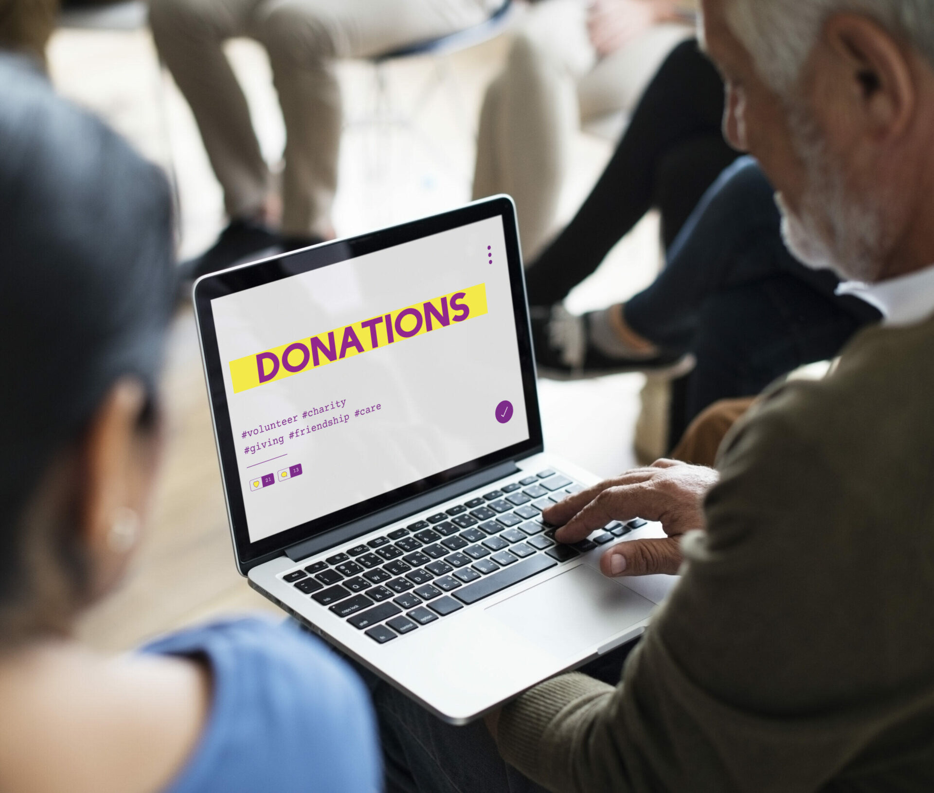Person viewing "Donations" page on laptop during a meeting
