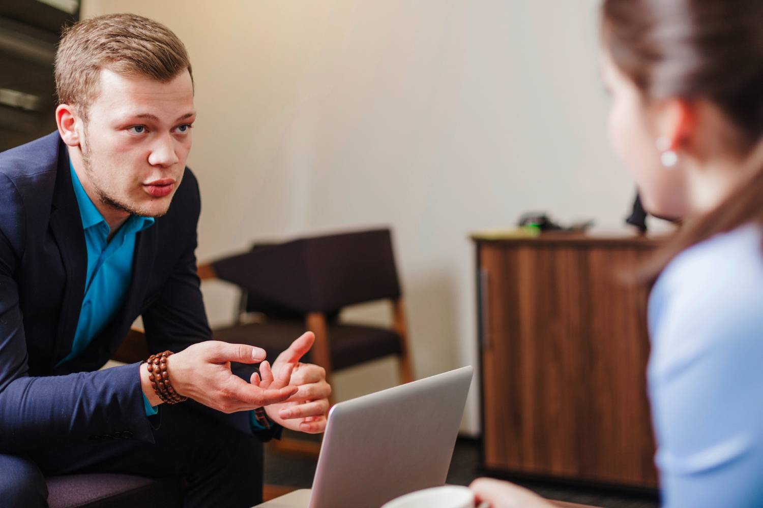 Lawyer discussing a charitable bequest and family provision claims with a client.