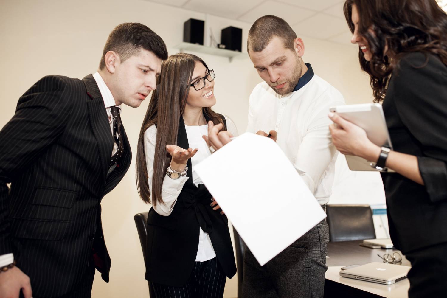 Team reviewing documents, possibly related to NFP member disputes.