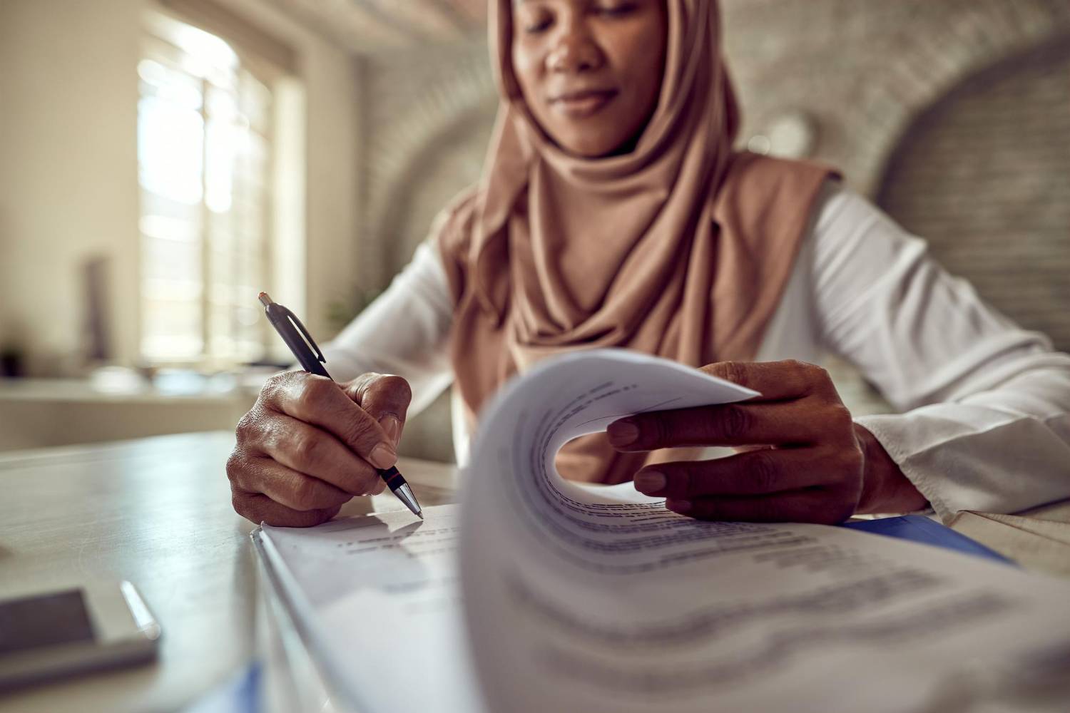 Woman writing in a document