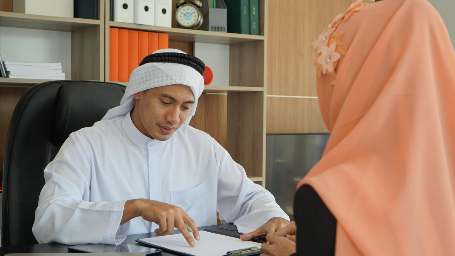 Man and woman discussing Islamic wills, wasiyyah bequests, and hibah lifetime gifts in NSW.