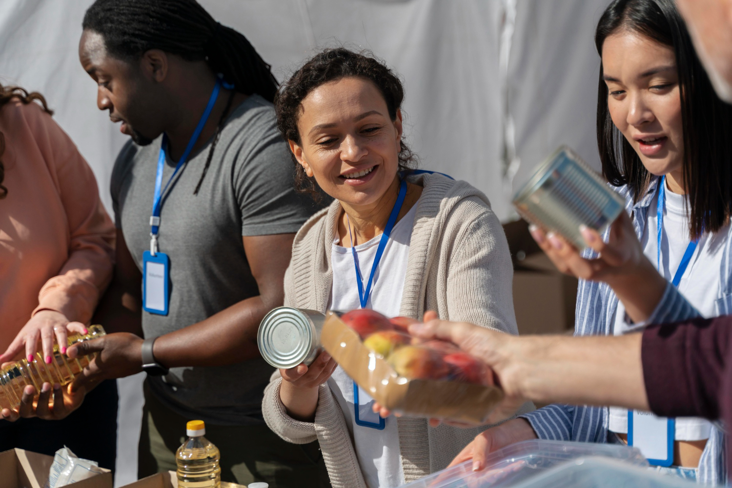 Volunteers sorting food donations for a charity event in Australia.