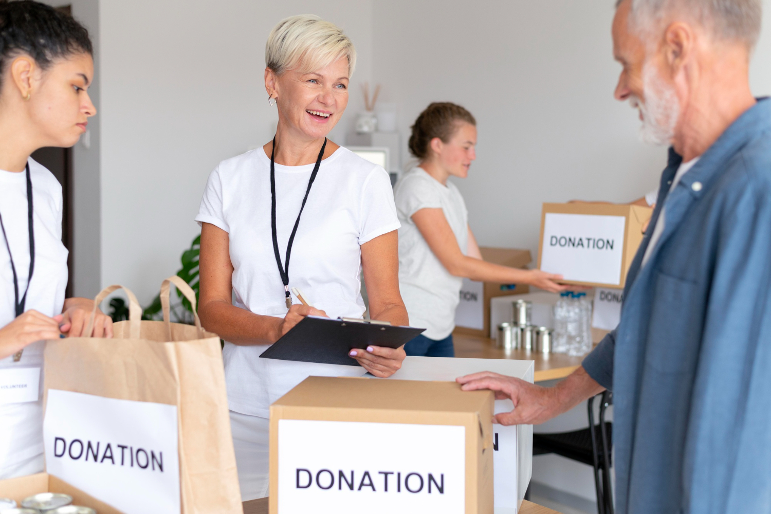 Volunteers sort donation boxes for NFP fund distribution