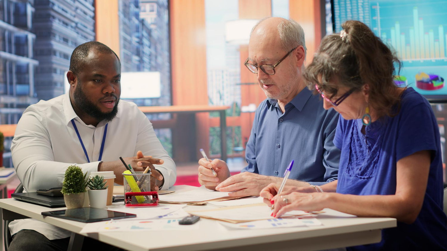 Charity tax reform discussion: diverse team reviews budget documents.