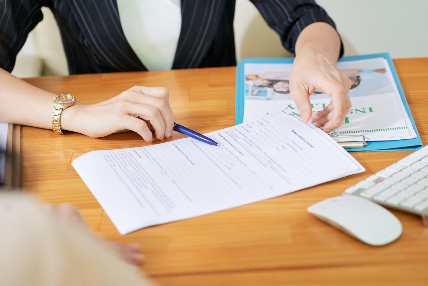 Person reviewing a "Grant of Letters of Administration" contract document.